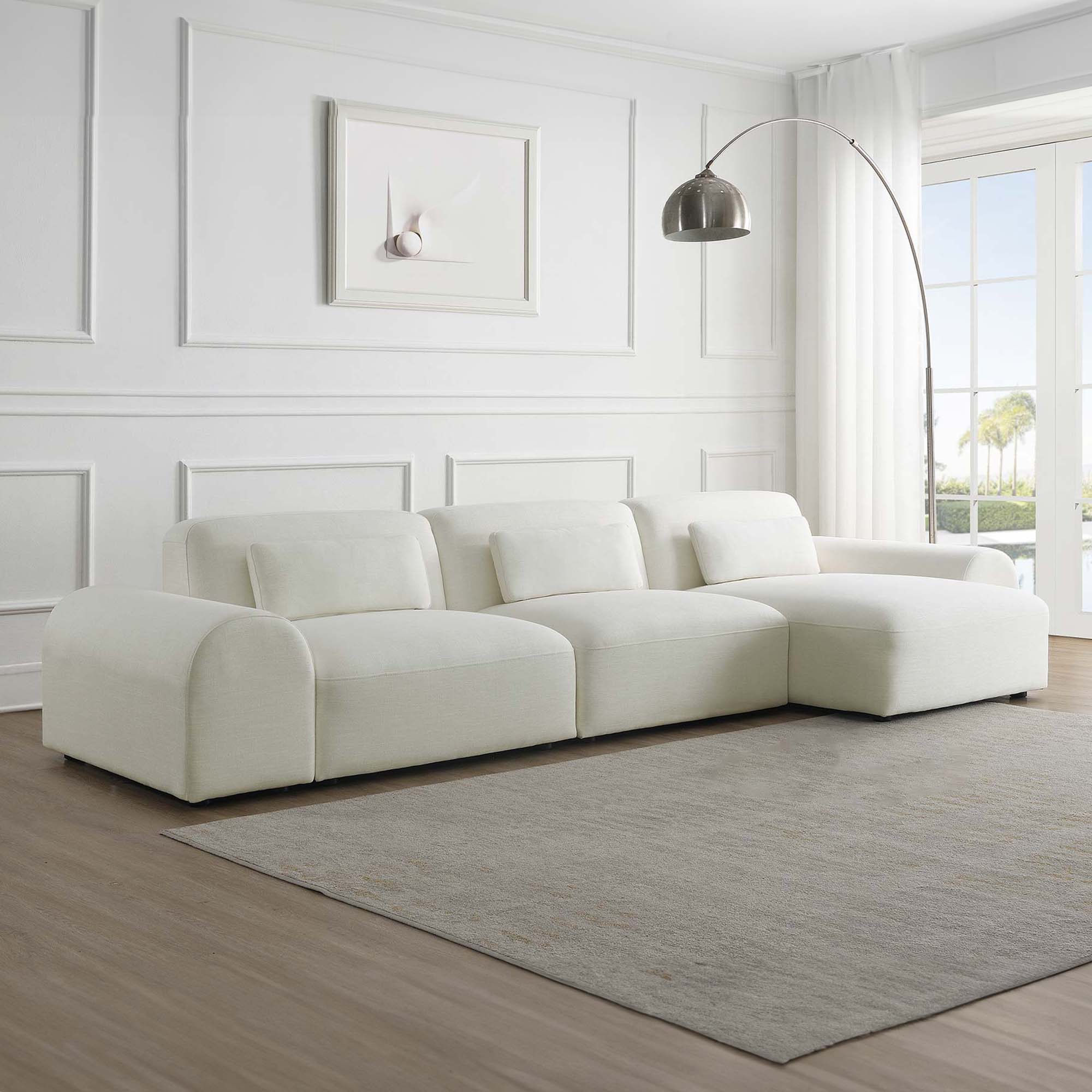 Canapé contemporain d'angle réversible en tissu blanc écru