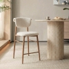 Tabouret en tissu beige pieds couleur bois