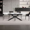 Table extensible rectangulaire en pierre fritt&eacute;e blanc pieds en m&eacute;tal noir 180-220