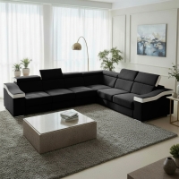 Canap&eacute; d&rsquo;angle convertible r&eacute;versible en tissu noir et simili blanc